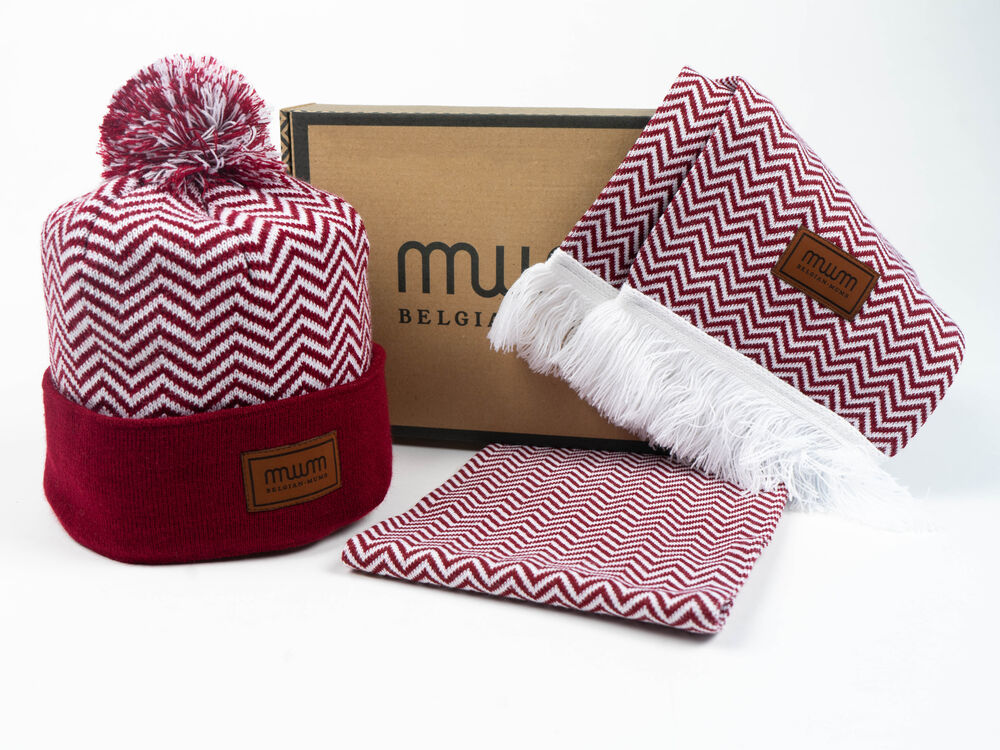 A custom gift set with a coordinated beanie and scarf presented in a bespoke branded box, showing packaging designed as part of the product