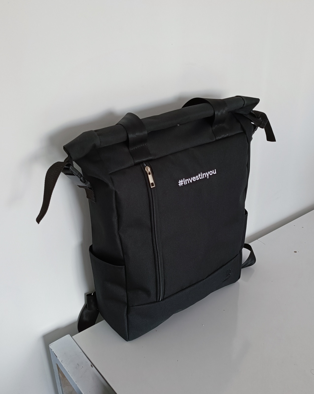 A custom branded backpack shown in a lifestyle setting