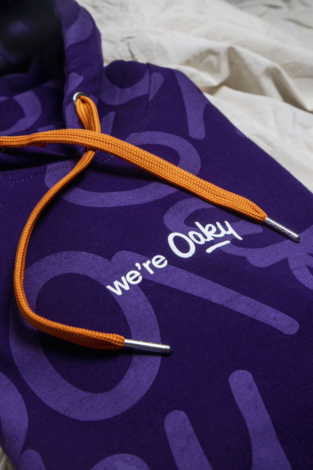 Printed graphic on a custom company hoodie, an example of full-colour print decoration