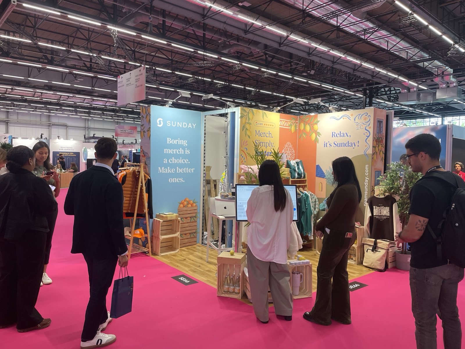 Visitors browsing Sunday merchandise at the Money20/20 booth