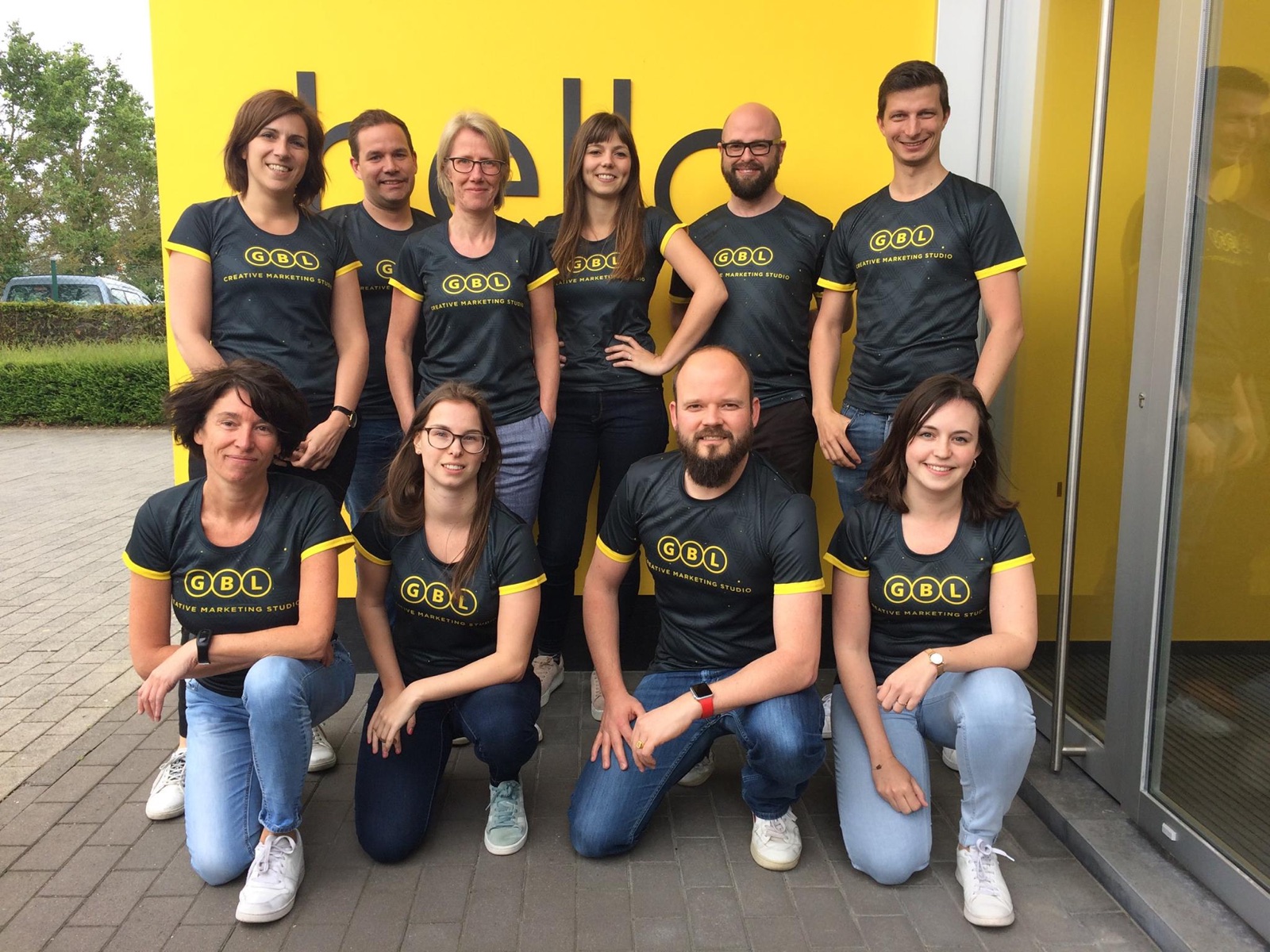 A GBL-branded custom sports jersey worn by a company team, showing eco sportswear that performs like standard kit