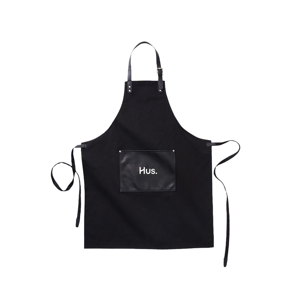 Un tablier en cuir haut de gamme avec une étiquette aspect cuir, la finition artisanale pour les tabliers en denim, barbecue et cadeaux