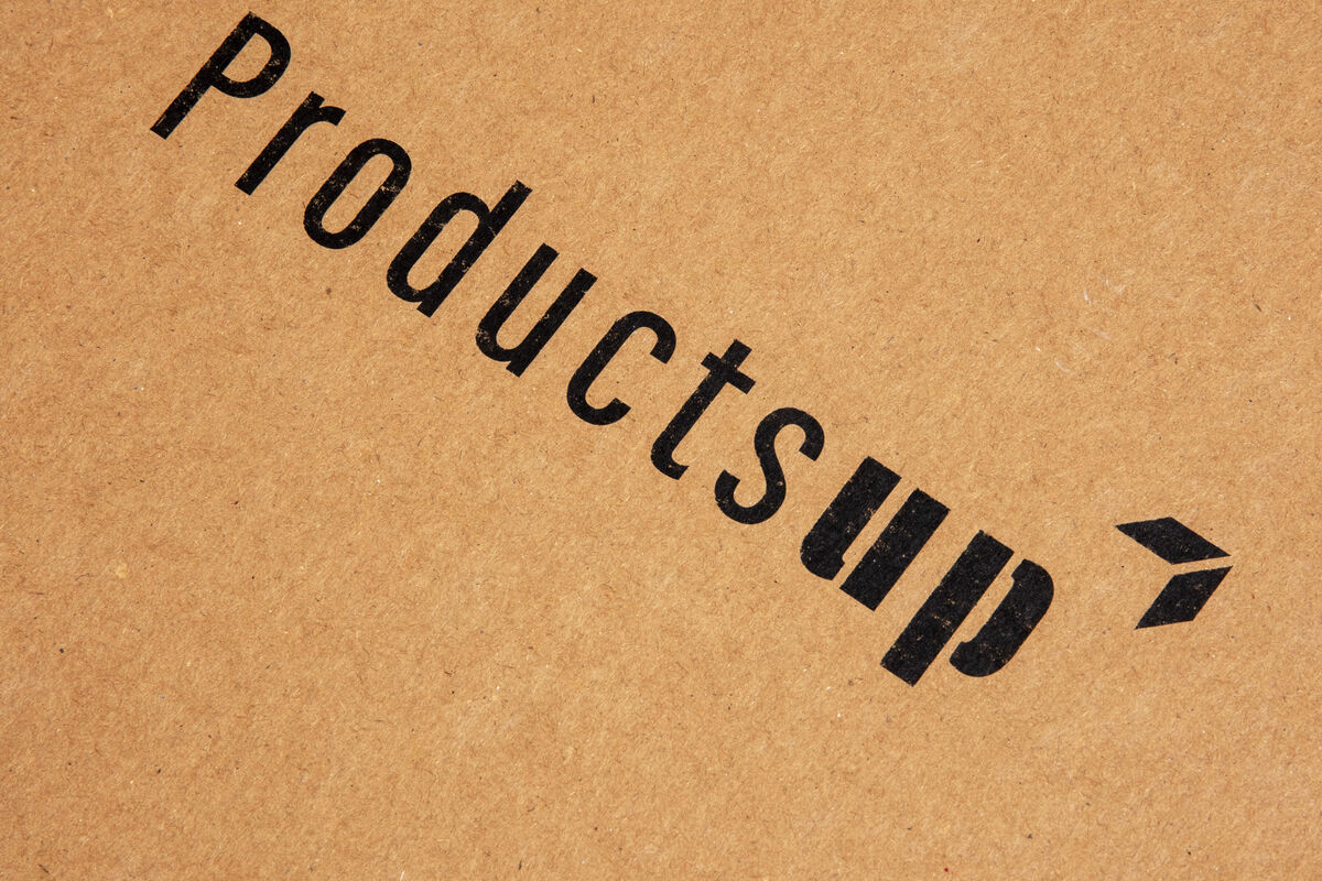 A branded kraft gift box printed with a company logo, showing how packaging carries perceived value for corporate gifts under $50
