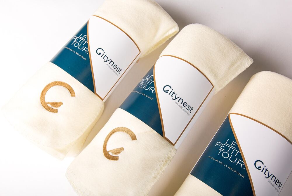 Stapel custom gebrande dekens voor Citynest door Sunday, geproduceerd als bulkbestelling voor een bedrijf