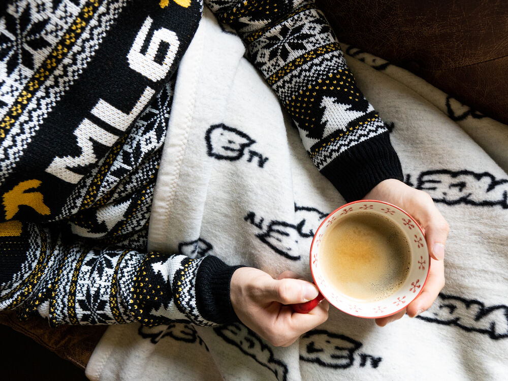 Reversible black and white knitted Vice blanket by Sunday, logo woven diagonally into the pattern