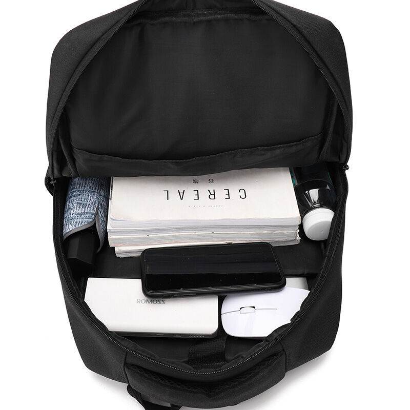 The interior of a premium branded backpack packed with a laptop, notebook and accessories, showing where a higher corporate gifting budget goes