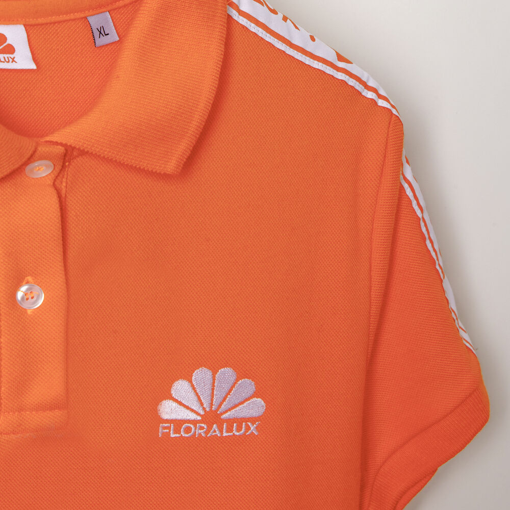 A branded polo in a strong colour combination, suited to a field-sales look with layers added on top