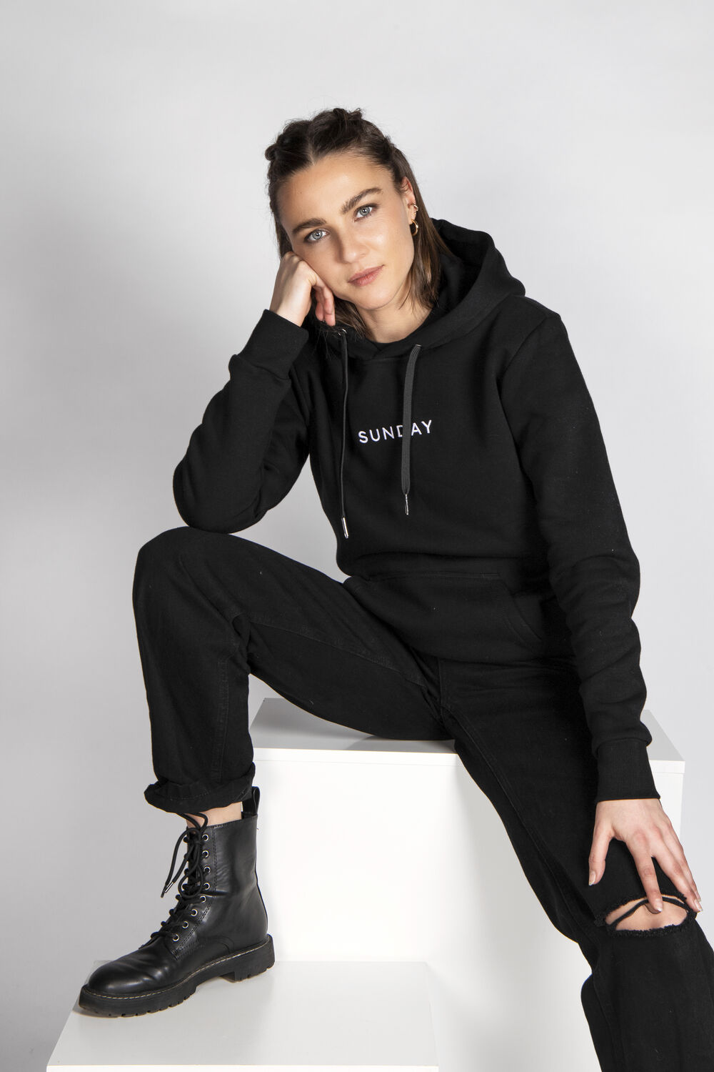 Branded company hoodie as the hero item in a new hire welcome kit