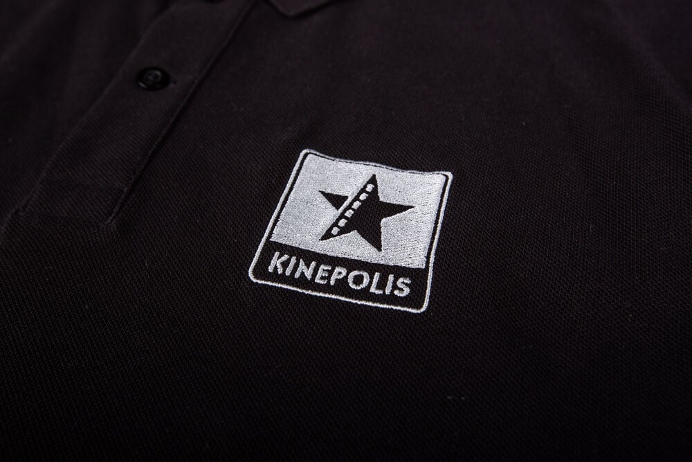 Corporate clothing for women: a branded polo with an embroidered logo on the chest