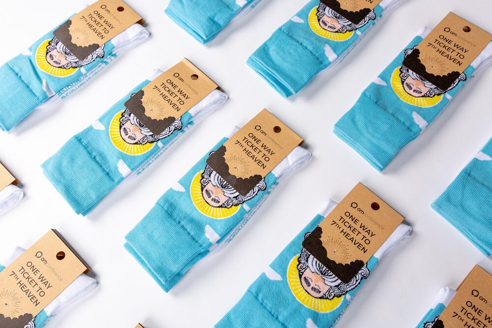 Multiple pairs of branded socks laid out with kraft packaging, showing how one category scales cleanly across budgets
