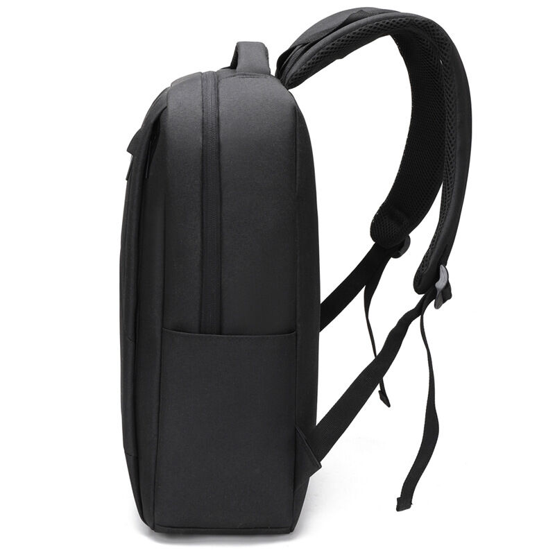 A black custom backpack used as the anchor item inside an automated partner onboarding kit