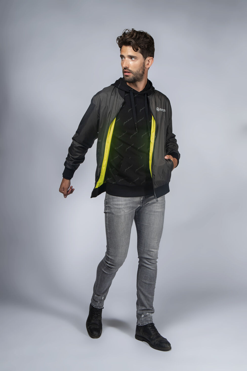 A branded jacket as the outer layer of a coordinated sales-team outfit