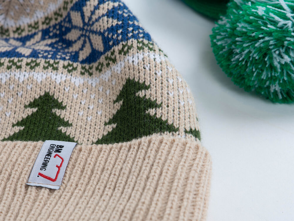 A range of branded beanies showing the style and decoration choices a supplier should offer