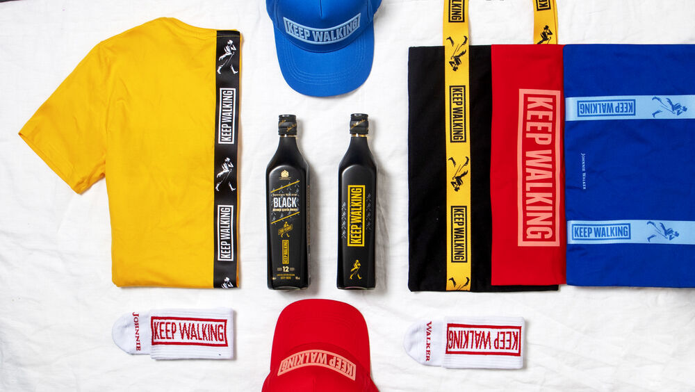 A spread of branded products from a single central catalogue, including apparel, bottles, towels and headwear, the kind of range a global corporate gifting program ships from one place