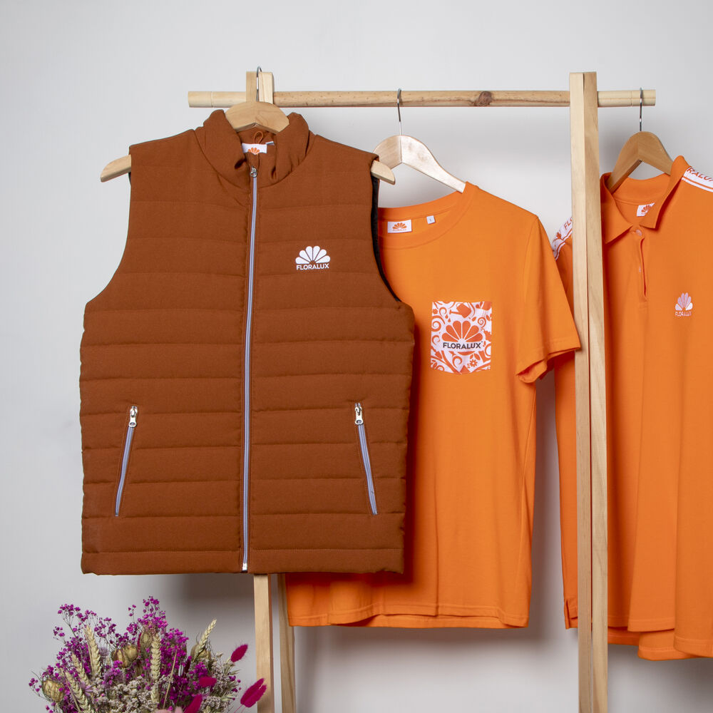 A branded bodywarmer layered over a polo, a versatile warm layer for sales teams
