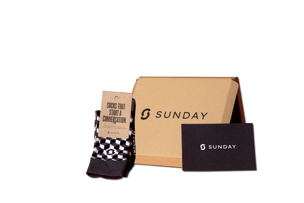 A smaller branded gift option with socks, a gift box and a card, presented as one choice in a curated selection of corporate gifts