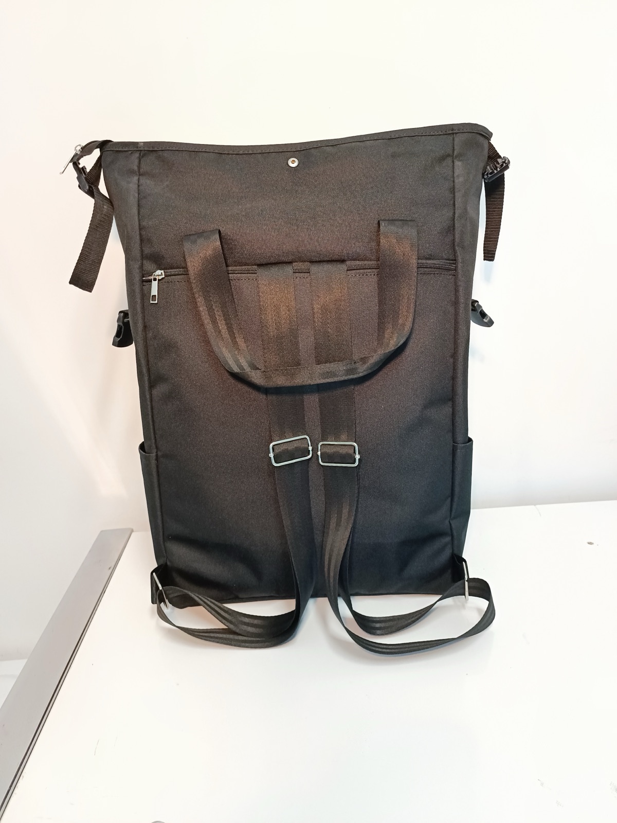 A custom branded backpack in everyday use, the kind of durable bag that carries the sustainability story