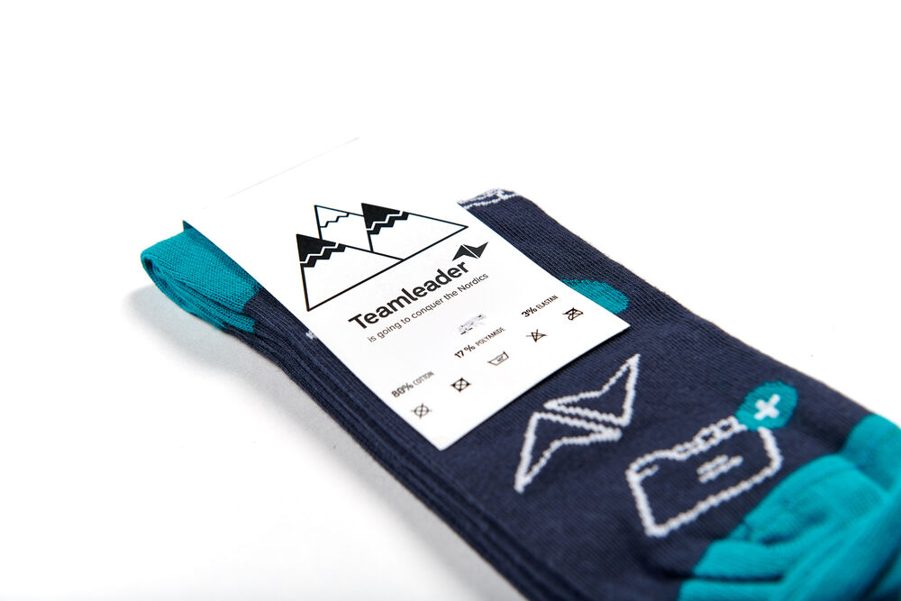 A pair of branded corporate socks presented with a printed card band, a low-risk, high-use employee gift that works at any budget
