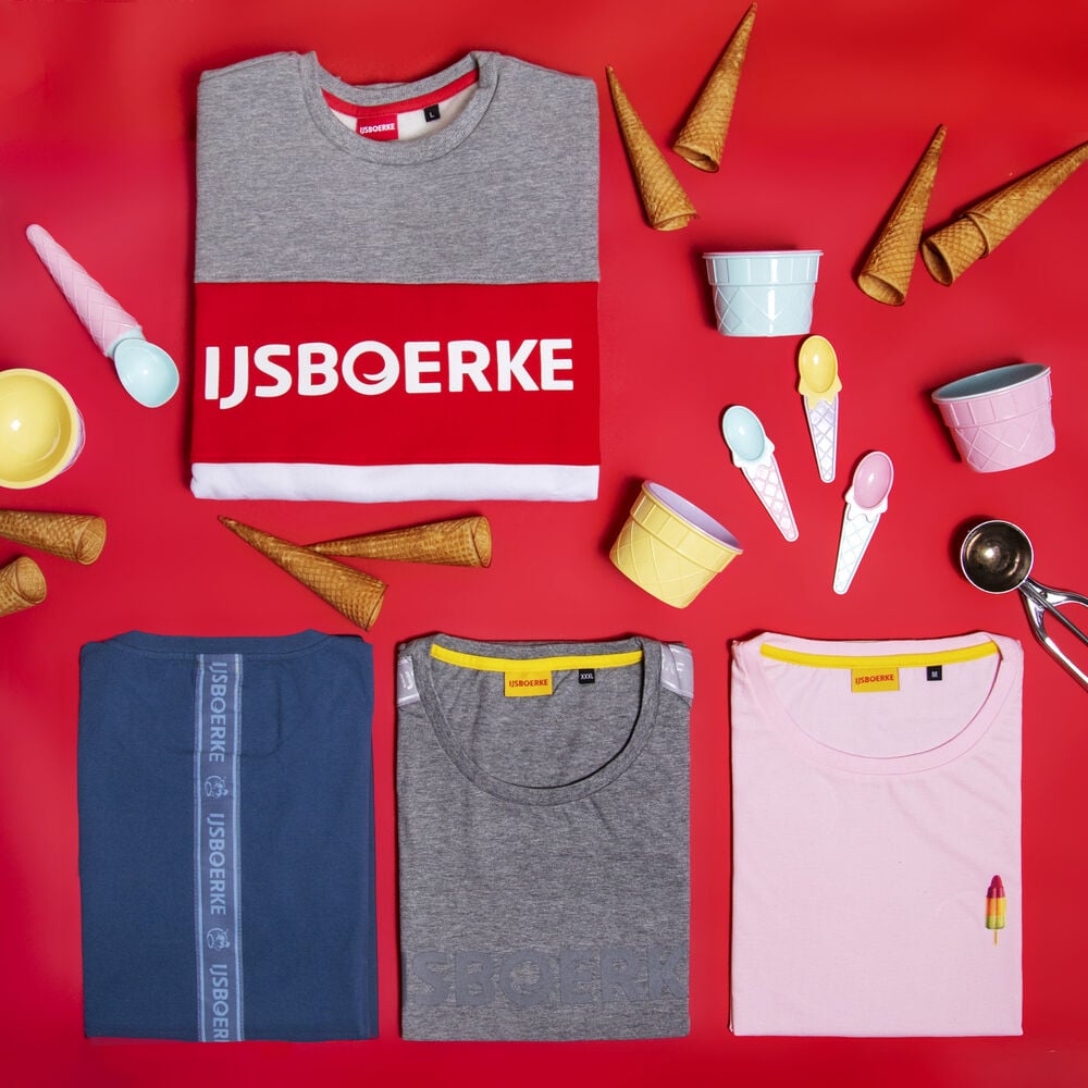Bedrijfskleding met een retro-toets: een gebrande collectie sweaters en T-shirts die aansluit bij het visuele erfgoed van het merk